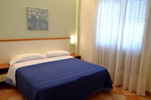 Posteľ alebo postele v izbe v ubytovaní L'Infinito Agriturismo - Rooms & Breakfast