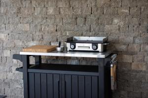 a table with a toaster on top of it at Villa Bella in Klimno +42 photos