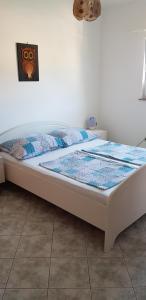 Ένα ή περισσότερα κρεβάτια σε δωμάτιο στο Apartments Vlasta