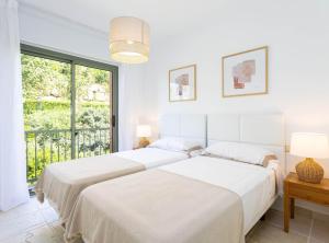 Postel nebo postele na pokoji v ubytování Mediterranean Swing - Royal Flamingos I Apartment + 26 fotografií