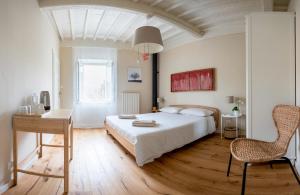 En eller flere senge i et værelse på La Dimora di Corte