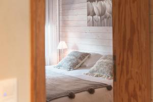 Postel nebo postele na pokoji v ubytování Maison Mariette