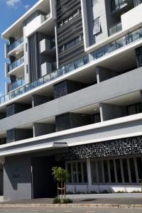 a large building with a lot of windows at Atrio Apartments in Brisbane