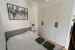Un pat sau paturi într-o cameră la Klip apartment