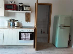 Kuchyň nebo kuchyňský kout v ubytování Ferienwohnung Elbblick
