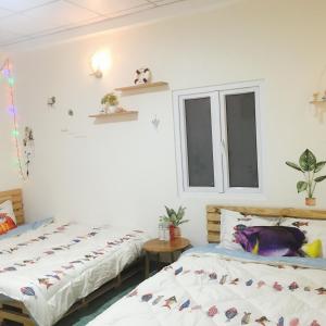 Postel nebo postele na pokoji v ubytování Dốc homestay Đà Lạt