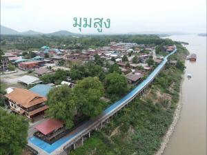 an aerial view of a town next to a river at สุขนิรันดร์​ริมโขง in Chiang Khan