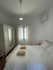 Postel nebo postele na pokoji v ubytování Kardiani Village Home