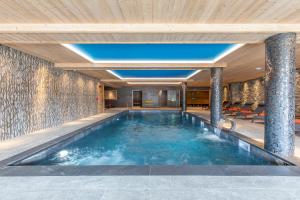 a swimming pool in a house at La Cour aux Ecureuils in Peisey-Nancroix