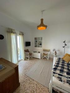 Postel nebo postele na pokoji v ubytování Kardiani Village Home