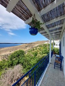 a porch with a view of the beach at Kardiani Village Home in Kardiani