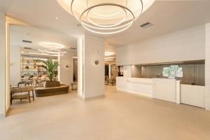 a large living room with a large chandelier at Holiday Inn Thessaloniki, an IHG Hotel in Thessaloniki