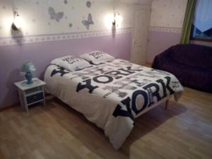 Katil atau katil-katil dalam bilik di Chambre d’hôte