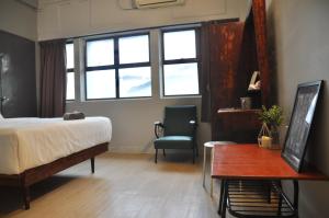 Postel nebo postele na pokoji v ubytování GRAYHAUS INN Ipoh