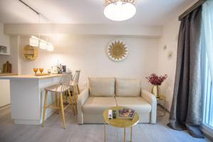 a living room with a couch and a table at Casa Iolanda I in Corfu