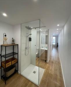 a bathroom with a glass shower in a room at Unique apartment in Coruña Old Town in A Coruña