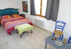 Ένα ή περισσότερα κρεβάτια σε δωμάτιο στο Soleil bleu