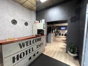 a hotel entrance with a welcome sign in a room at Hotel Andy in Bucharest