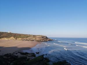 an aerial view of a beach and the ocean at Alto da Praia Villa in Colares