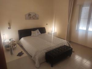 En eller flere senge i et værelse på Rifugio sul mare