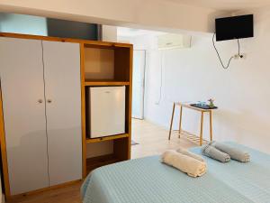 Postel nebo postele na pokoji v ubytování Tzavelitiko Home