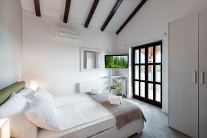 Posteľ alebo postele v izbe v ubytovaní Villa Maslina San Lorenzo
