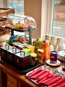 a kitchen counter with a table with food on it at Marlborough Hotel in Norwich