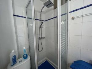 a shower with a glass door in a bathroom at Studio Cabine 4 Couchages avec Balcon et Parking - Saint-Jean-de-Monts - FR-1-224C-18 in Saint-Jean-de-Monts