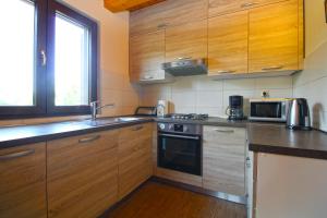 Kuchyň nebo kuchyňský kout v ubytování House Stella 1319