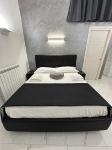 Säng eller sängar i ett rum på La casetta bed and breakfast