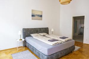 Postel nebo postele na pokoji v ubytování Vienna City Apartments Unteres Belvedere