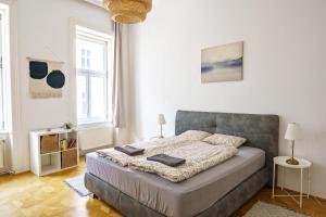 Postel nebo postele na pokoji v ubytování Vienna City Apartments Unteres Belvedere