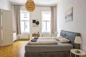 Postel nebo postele na pokoji v ubytování Vienna City Apartments Unteres Belvedere