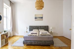 Postel nebo postele na pokoji v ubytování Vienna City Apartments Unteres Belvedere