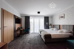 Postel nebo postele na pokoji v ubytování Hotel Polonia PARK Medical Center & Spa