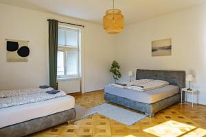 Postel nebo postele na pokoji v ubytování Vienna City Apartments Unteres Belvedere