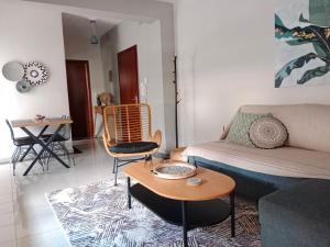 a living room with a couch and a table at Central Lodge in Kalabaka