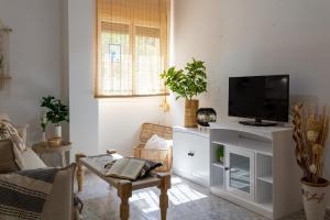 Televízia a/alebo spoločenská miestnosť v ubytovaní Apartamento puerto de Jávea Esmeralda home