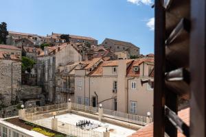 a view of the city from the roof of a building at Apartments and Rooms Lejletul in Dubrovnik