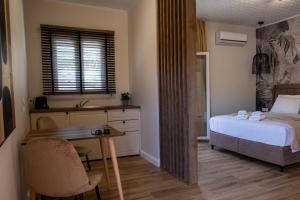 Ένα ή περισσότερα κρεβάτια σε δωμάτιο στο Cristina Apartments