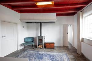 TV a/nebo společenská místnost v ubytování Het Kostershuisje