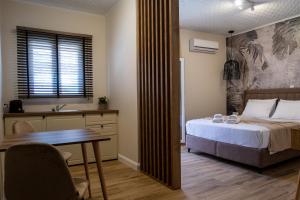 Ένα ή περισσότερα κρεβάτια σε δωμάτιο στο Cristina Apartments
