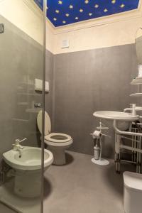 a bathroom with a toilet and a sink at San Leo Albergo Diffuso in San Leo