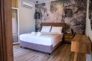 a bedroom with a bed with two mugs on it at Cristina Apartments in Gaios