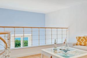 a living room with a couch and a table at L'incanto di Venere in Portovenere