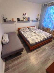 a bedroom with a bed and a bench in it at House of Relax in Řečany nad Labem