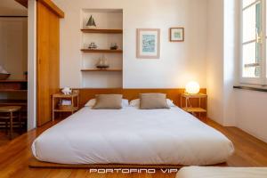 Postel nebo postele na pokoji v ubytování Giada by PortofinoVip