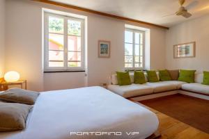 Postel nebo postele na pokoji v ubytování Giada by PortofinoVip
