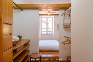 Postel nebo postele na pokoji v ubytování Giada by PortofinoVip