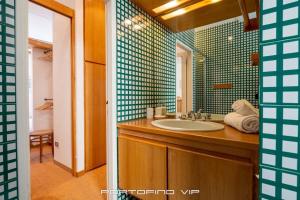 a bathroom with a sink and a mirror at Seaview Open Space Loft by PortofinoVip in Portofino